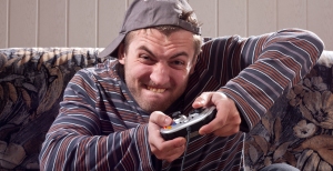 Man with joystick playing video games